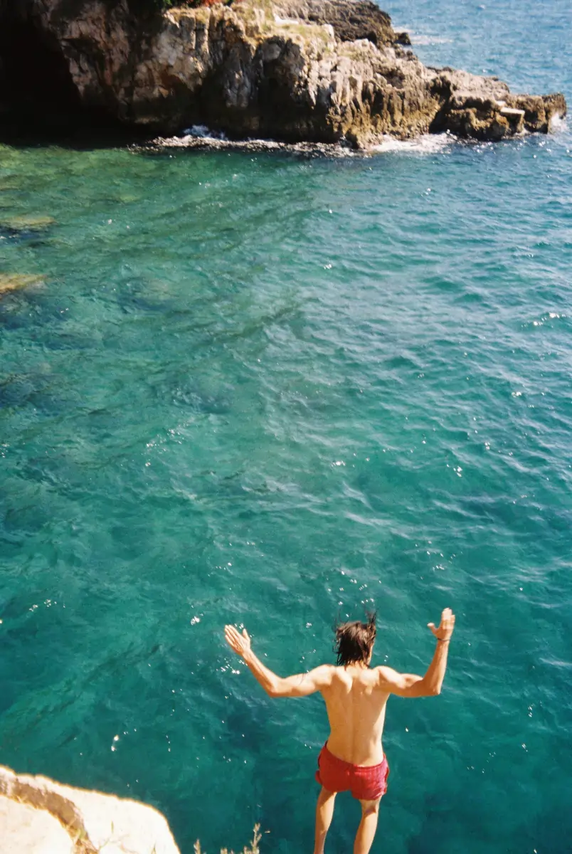 Jumping off the cliffs near Rovinj