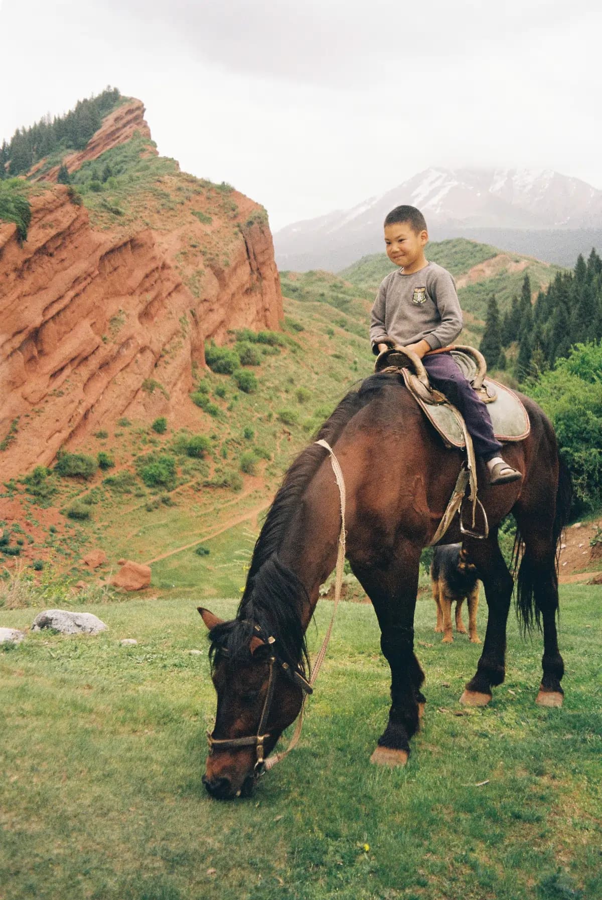 Issyk-Kul, Kyrgyzstan - Lakeside Views - A young local boy riding his horse in Jeti-Ögüz